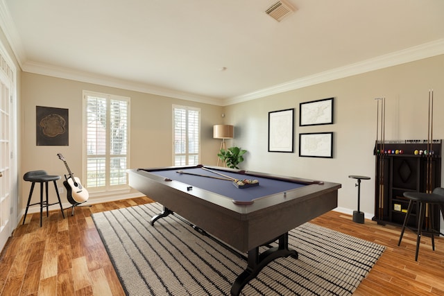 game room featuring hardwood / wood-style floors, crown molding, and billiards