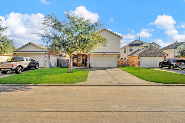 view of front of property featuring a garage and a front lawn