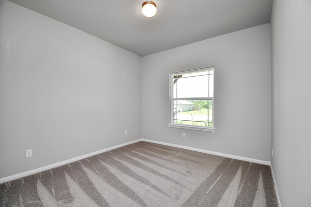 unfurnished room with carpet