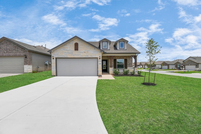 view of front of house featuring a garage and a front lawn