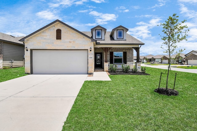 view of front of home with a front lawn and a garage