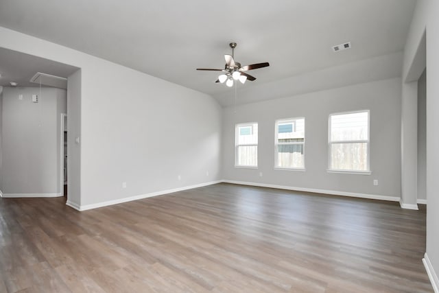 spare room featuring wood-type flooring and ceiling fan