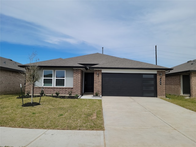 ranch-style home featuring a garage and a front yard