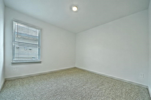 unfurnished room with carpet flooring