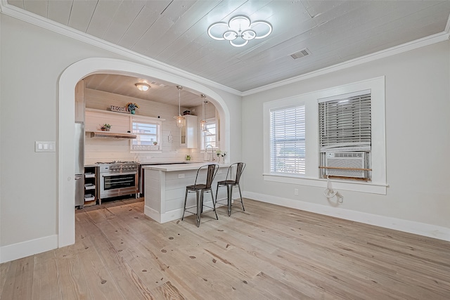 bar with hanging light fixtures, wooden ceiling, light hardwood / wood-style floors, and stainless steel appliances