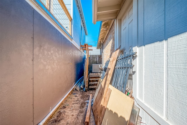 view of side of home featuring cooling unit