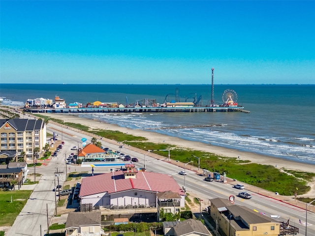 bird's eye view featuring a water view and a view of the beach