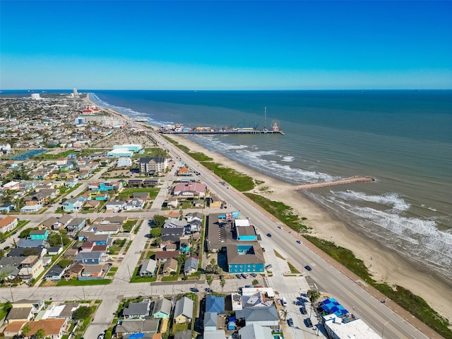 drone / aerial view with a beach view and a water view