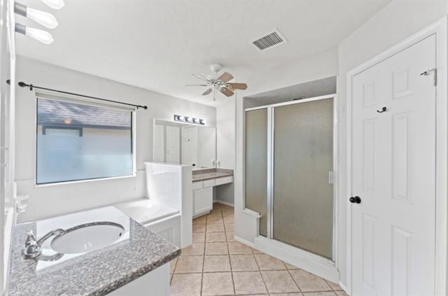 bathroom featuring tile patterned flooring, shower with separate bathtub, ceiling fan, and vanity