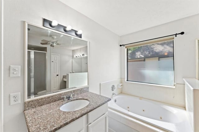 bathroom featuring vanity, plus walk in shower, and ceiling fan