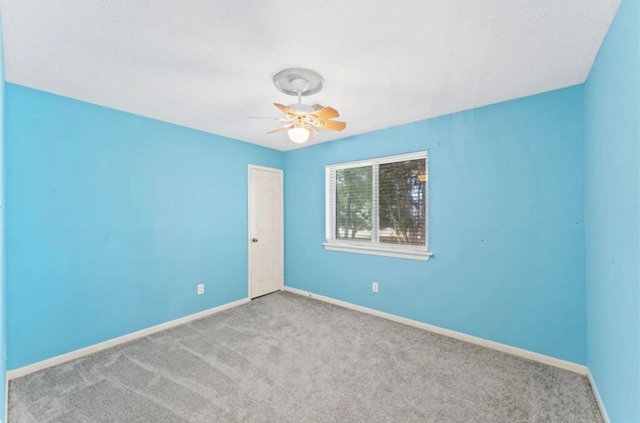 spare room with light colored carpet