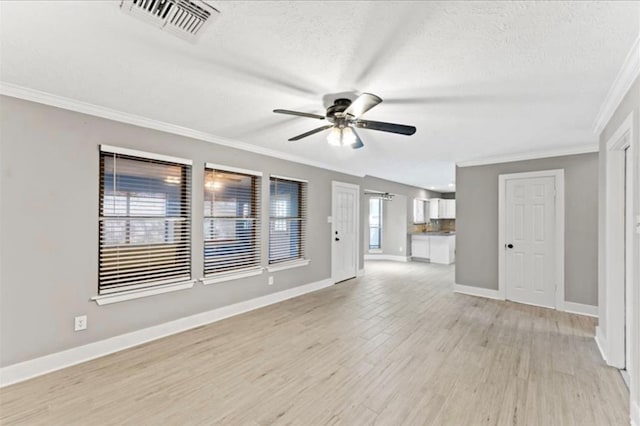 unfurnished living room featuring ceiling fan, a textured ceiling, light wood-type flooring, and ornamental molding