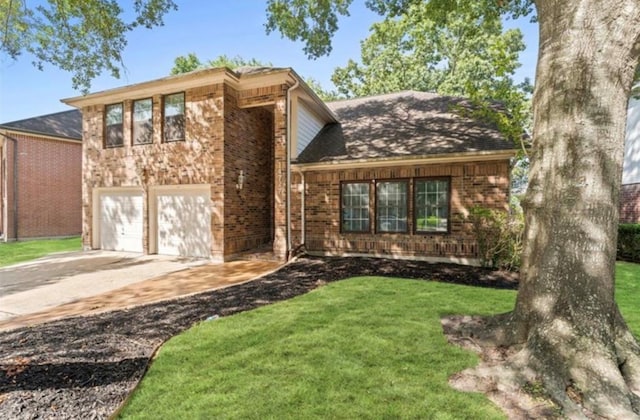 view of front of property featuring a garage and a front yard