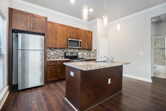 kitchen featuring hanging light fixtures, dark hardwood / wood-style floors, and appliances with stainless steel finishes