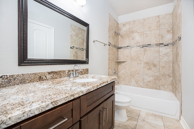 full bathroom featuring tile patterned flooring, vanity, toilet, and tiled shower / bath