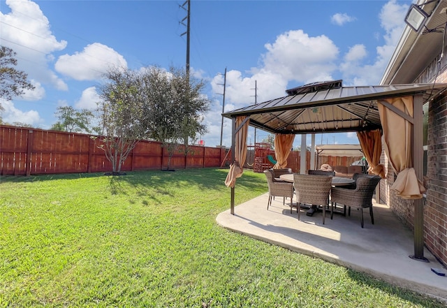 view of yard featuring a playground, a gazebo, and a patio area