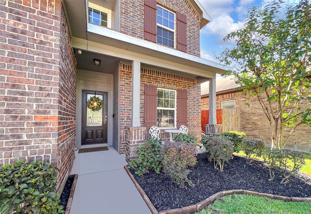 property entrance featuring covered porch