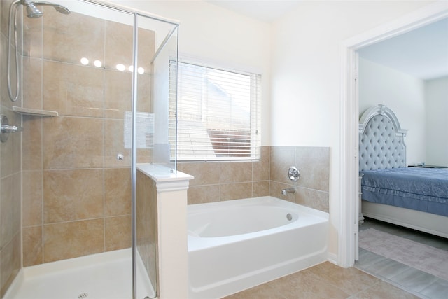 bathroom featuring separate shower and tub and tile patterned floors