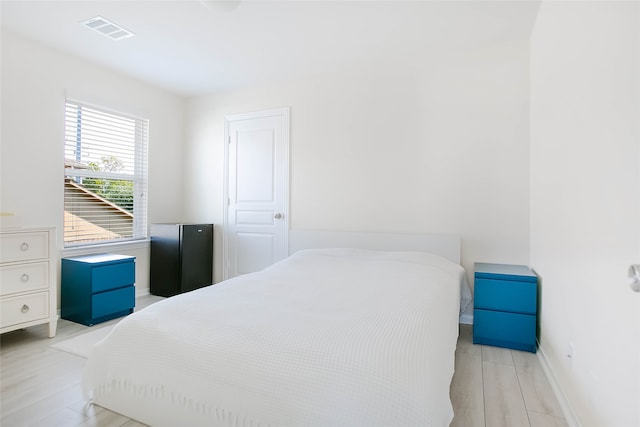 bedroom with light wood-type flooring