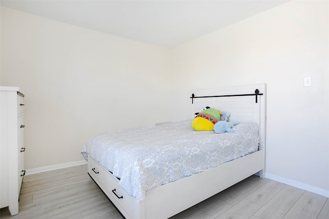 bedroom with light hardwood / wood-style flooring