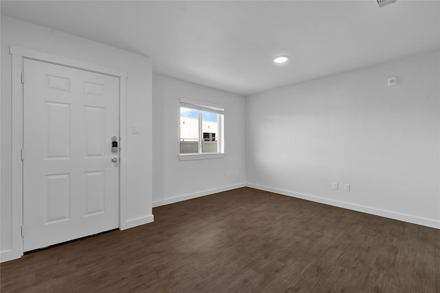 entrance foyer with dark hardwood / wood-style floors