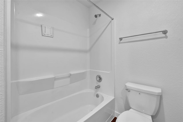 bathroom with toilet and tub / shower combination