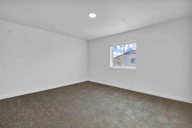 empty room featuring carpet flooring