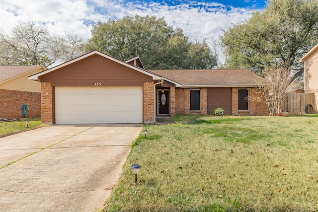 single story home with a garage and a front lawn