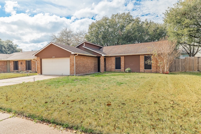 ranch-style house with a garage and a front yard