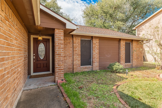 doorway to property featuring a yard