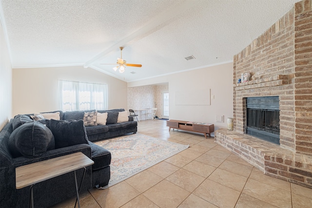 living room with ceiling fan, a textured ceiling, vaulted ceiling with beams, and a fireplace