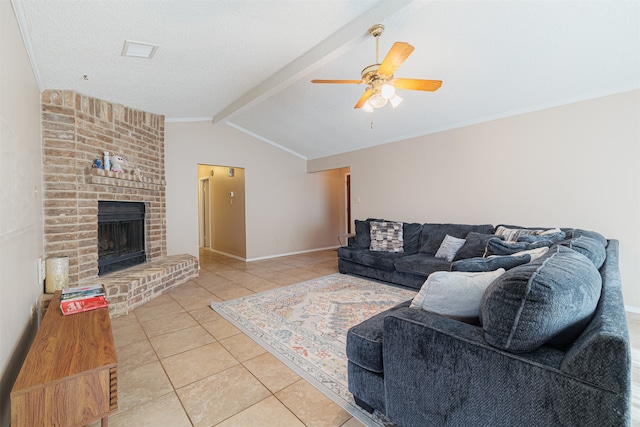 tiled living room with a brick fireplace, lofted ceiling with beams, and ceiling fan