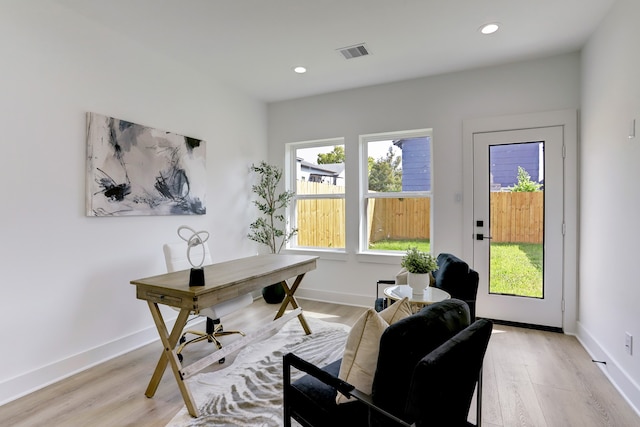 office area with light hardwood / wood-style flooring