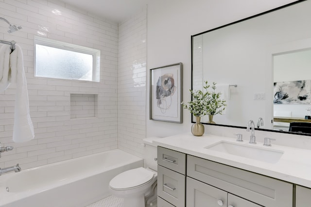 full bathroom featuring vanity, toilet, and tiled shower / bath