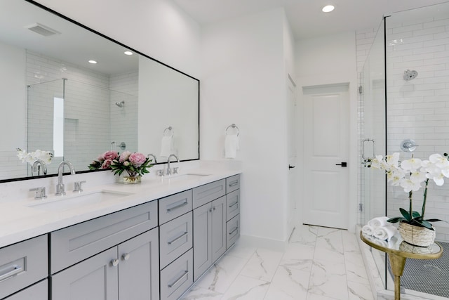 bathroom with vanity and an enclosed shower