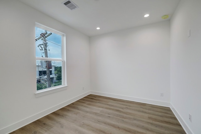 unfurnished room featuring light hardwood / wood-style flooring