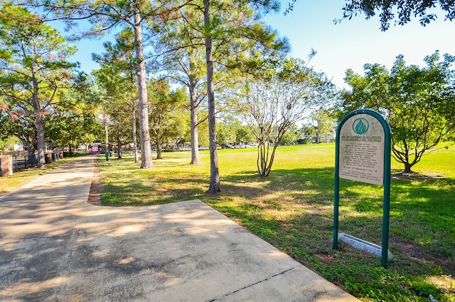 view of home's community with a yard