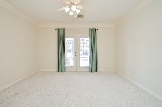 carpeted empty room featuring crown molding, french doors, and ceiling fan