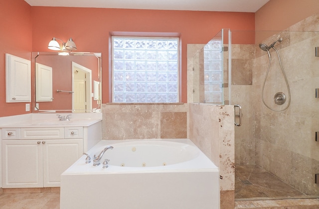 bathroom with vanity and independent shower and bath