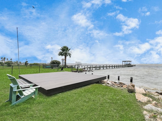 exterior space with a water view and a yard