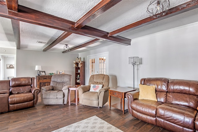 living room featuring crown molding, a textured ceiling, dark hardwood / wood-style flooring, and beam ceiling