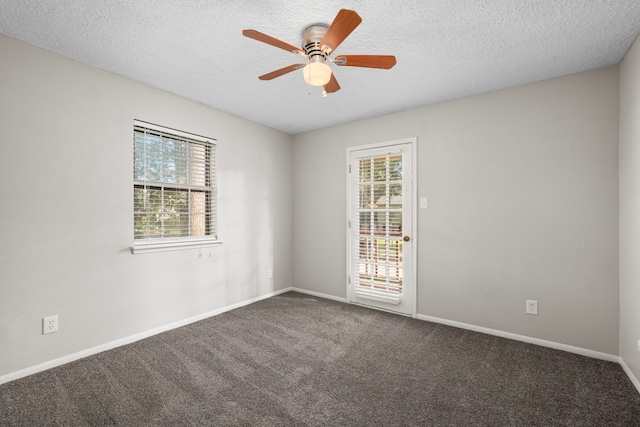 carpeted spare room with ceiling fan and a textured ceiling