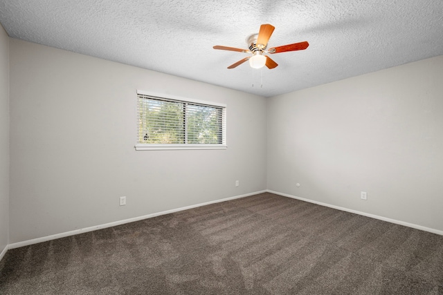 carpeted spare room featuring ceiling fan and a textured ceiling