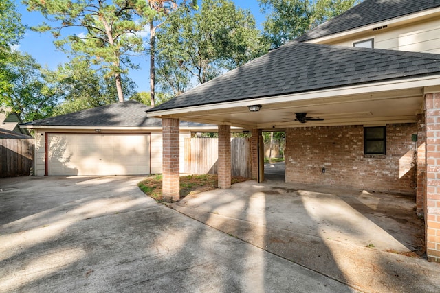 exterior space featuring a garage and ceiling fan