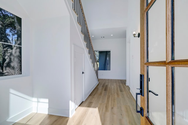 hall with light hardwood / wood-style flooring