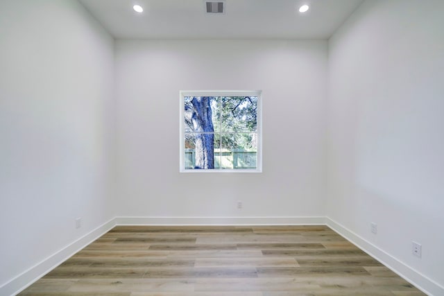 spare room with light hardwood / wood-style flooring