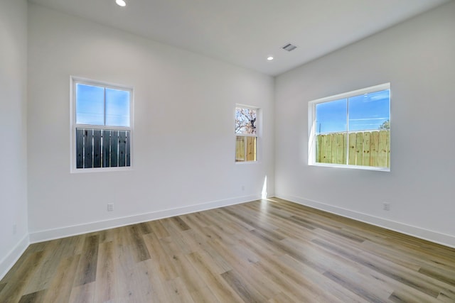 spare room featuring light wood-type flooring