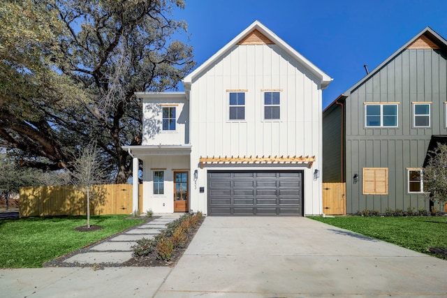 view of front of home with a garage and a front yard