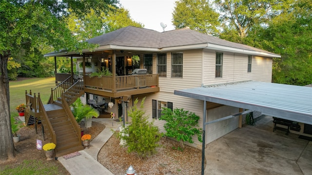 view of front of property with a carport and a garage