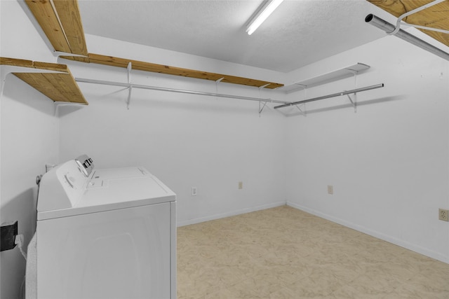 laundry room featuring washer and clothes dryer